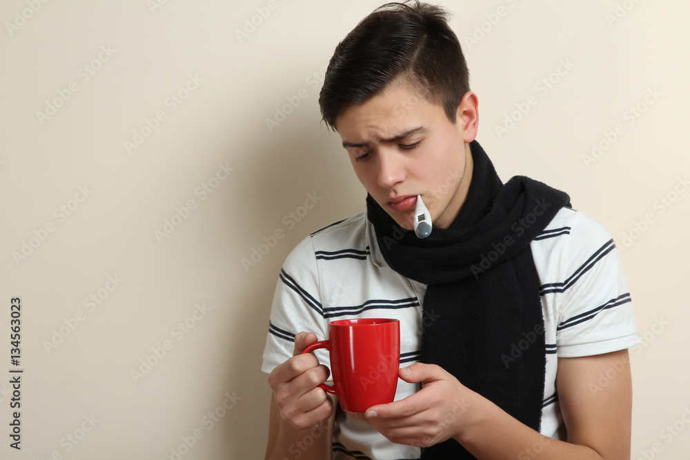 A sick man measures the temperature of the thermometer. A sick man measures the temperature of the thermometer.