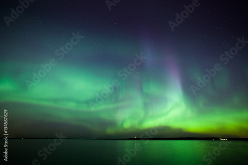 Northern lights over lake in finland