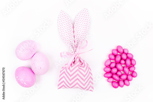 Bunny treat bag with candy and pink eggs. Easter concept © igishevamaria