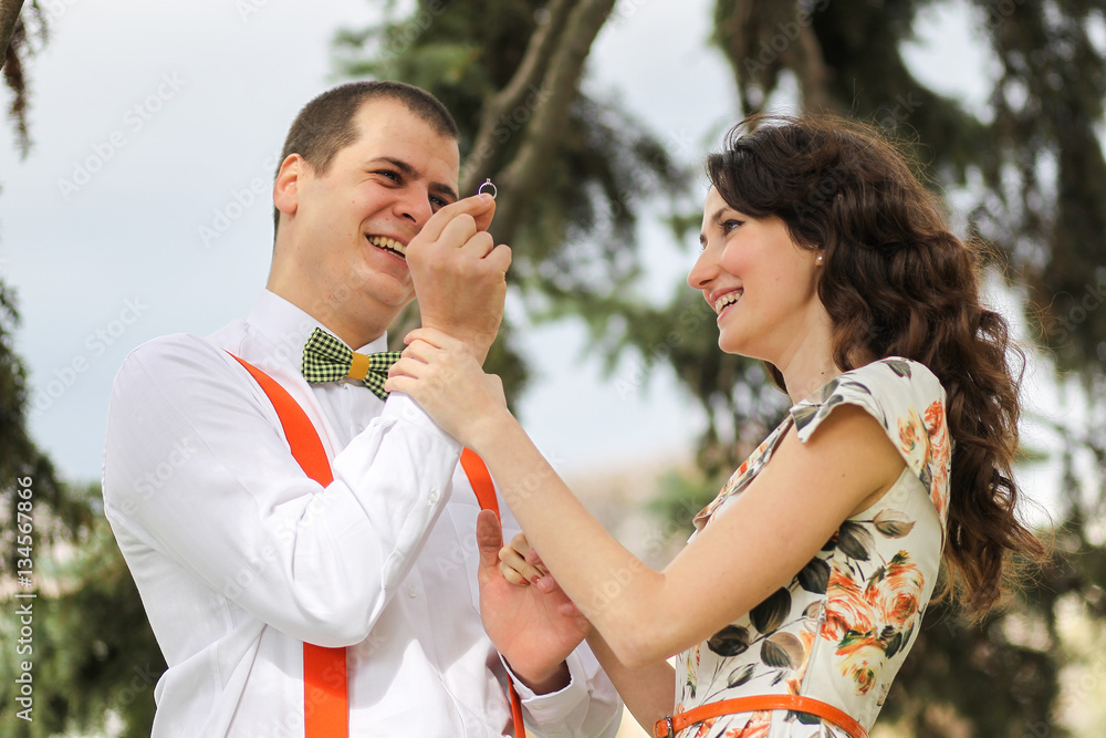 Fototapeta premium Young couple engagement session, sunny day