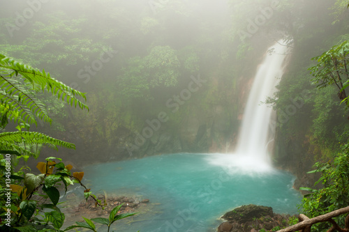 Cuadro en lienzo Rio celeste waterfall at foggy day
