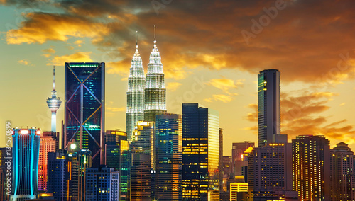 Photography Kuala Lumpur City skyline with urban skyscrapers at sunset.
