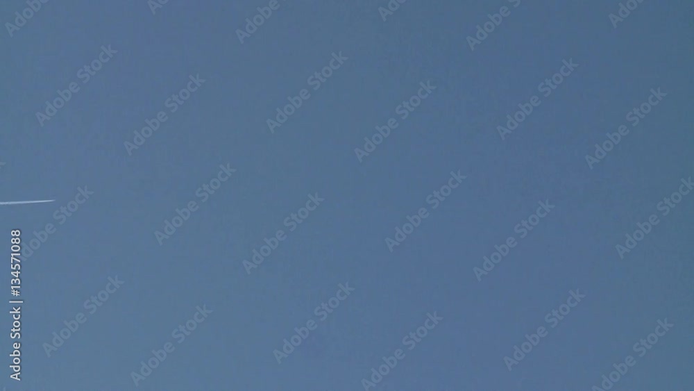 Four Jet Plane Contrails Cross Sky in Formation Four Jet Plane Contrails Cross Sky in Formation