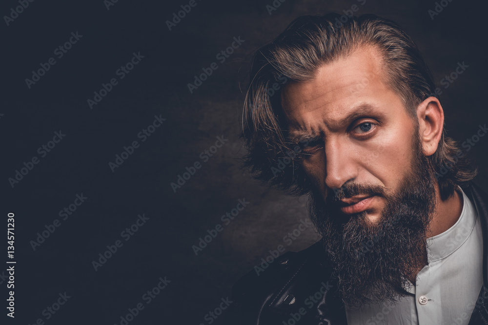 Obraz premium A man in a black leather jacket.