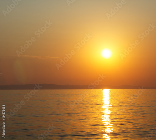 Amazing colors of sunset over summer sea. © mitarart