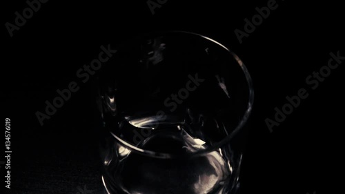 Slow mo ice cubes in a glass