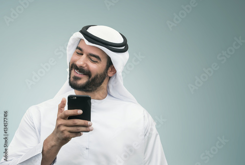 Arabian Businessman smiling on the phone.. © Ramzi
