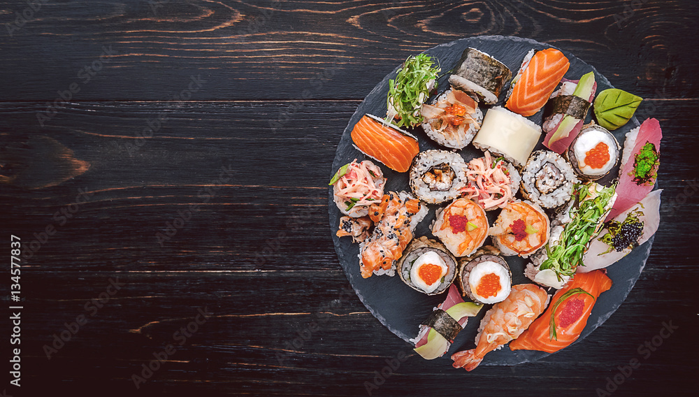 sushi on a black wooden surface