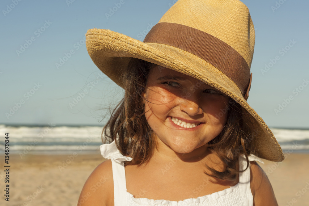 Close up portrait girl smile earing wicker hat in summer. Sunset