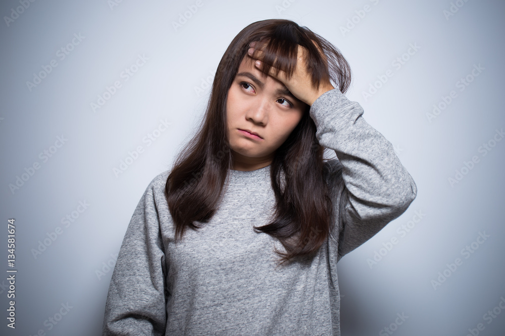 Woman has head ache on isolated background Woman has head ache on isolated background