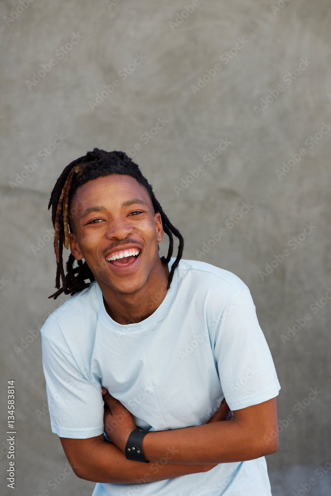 young african man with dreadlocks laughing young african man with dreadlocks laughing
