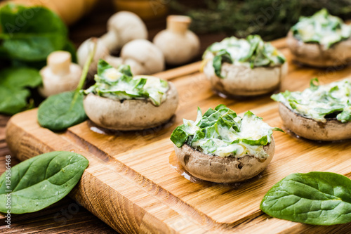 Cooked mushrooms stuffed with spinach and cheese