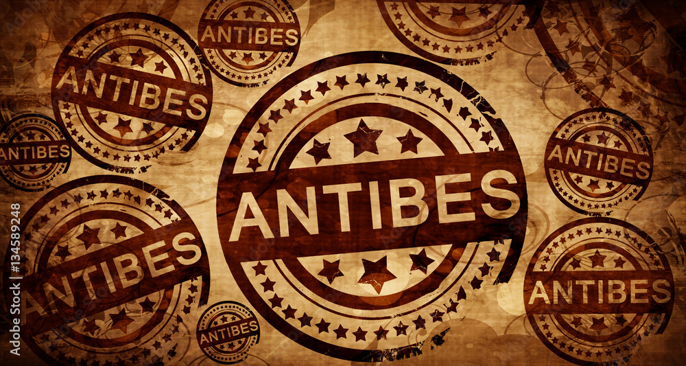 antibes, vintage stamp on paper background