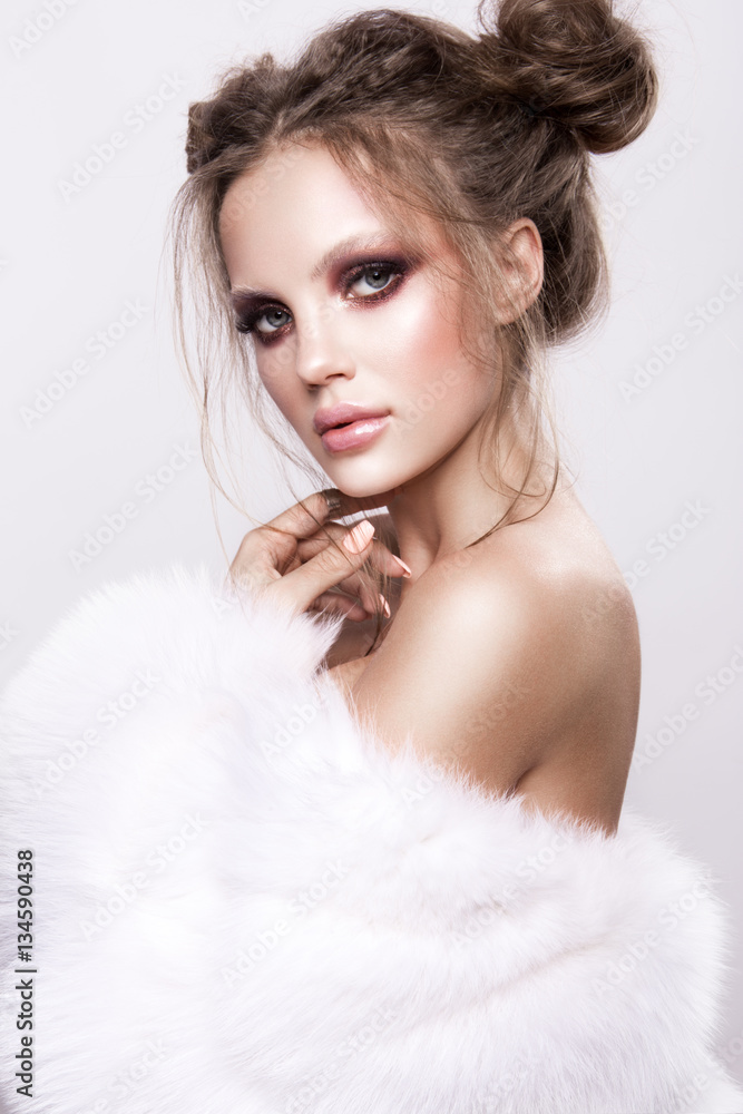 Beautifful european brunet woomen with gloss clean healfy skin, glooss shiny pastel pink lipstik and with trendy fashion hairstyle in white fluffy fur coat Beautifful european brunet woomen with gloss clean healfy skin, glooss shiny pastel pink lipstik and with trendy fashion hairstyle in white fluffy fur coat