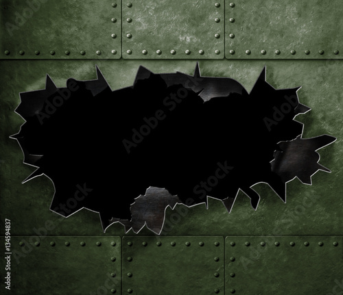 big hole in military green metal armor background