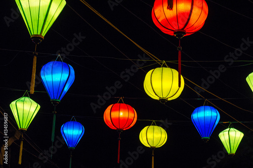 Colorful lanterns spread light on the old street of Hoi An Ancient Town - UNESCO World Heritage Site. Vietnam.