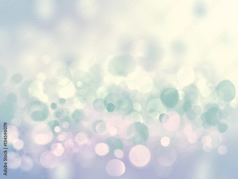 Fototapeta premium Christmas pale bright blue glowing bokeh winter glitter texture