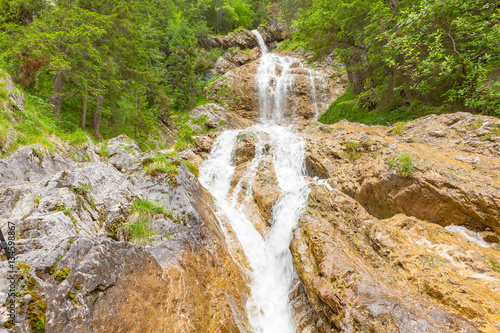 amazing waterfall in hinterstein (bavaria - germany) photo