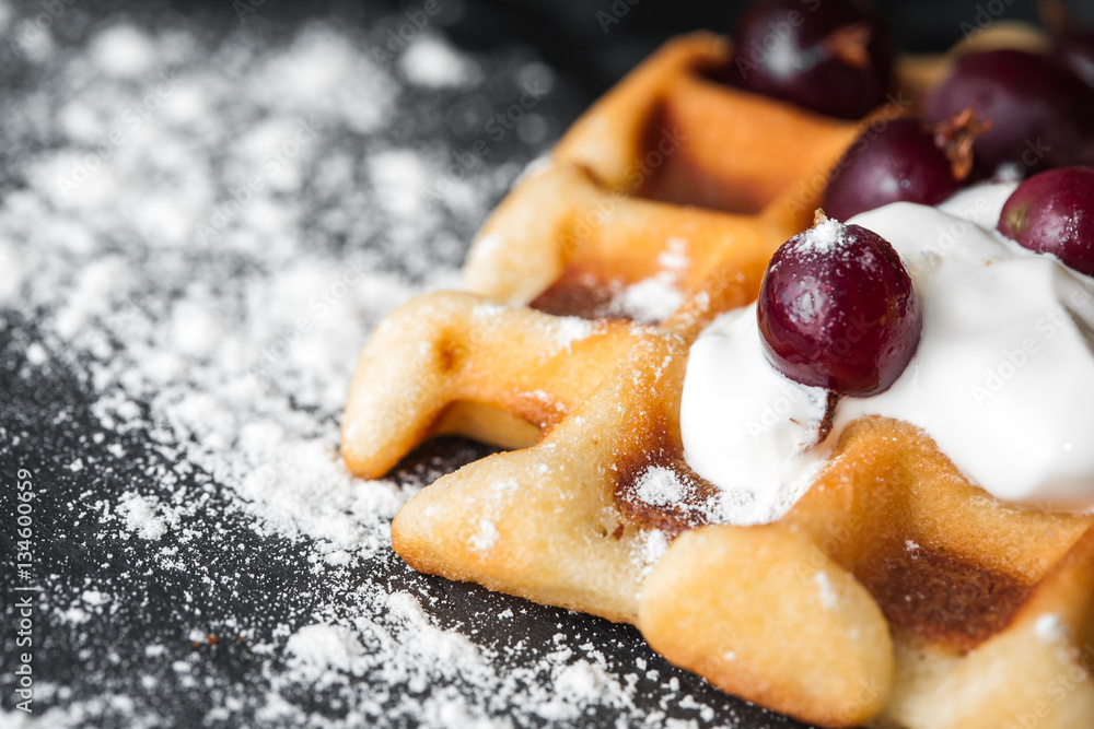 homemade Belgian waffles with berries, whipped cream