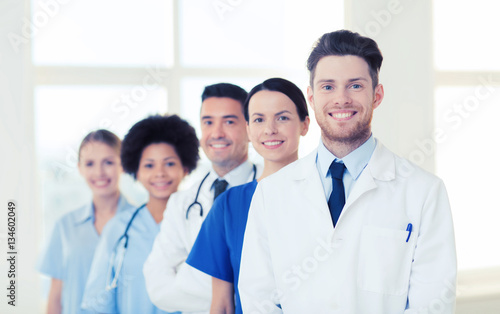 group of happy doctors at hospital