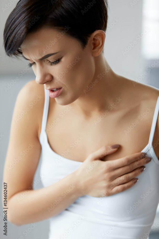 Health Issues. Beautiful Woman Feeling Strong Pain In Chest Health Issues. Beautiful Woman Feeling Strong Pain In Chest