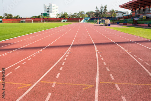 A stadium is a place for outdoor sports consists of a field or stage either partly or completely surrounded by a tiered structure designed to allow spectators to stand or sit and view the event.
