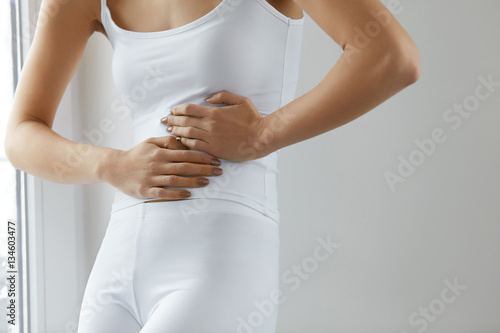 Body Pain. Close Up Of Beautiful Woman Body Having Stomach Ache