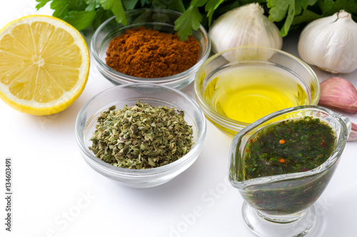 Green Chimichurri Sauce and ingredients isolated on white background 