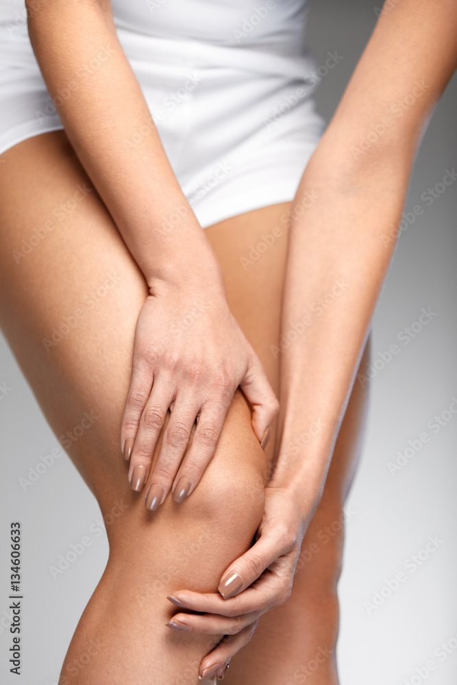 Painful Knee. Closeup Of Woman Feeling Pain In Knees.