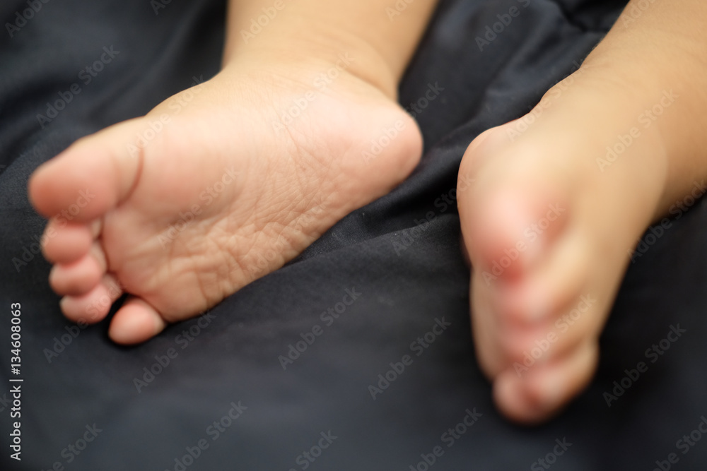 close up bare feet of a cute newborn baby close up bare feet of a cute newborn baby