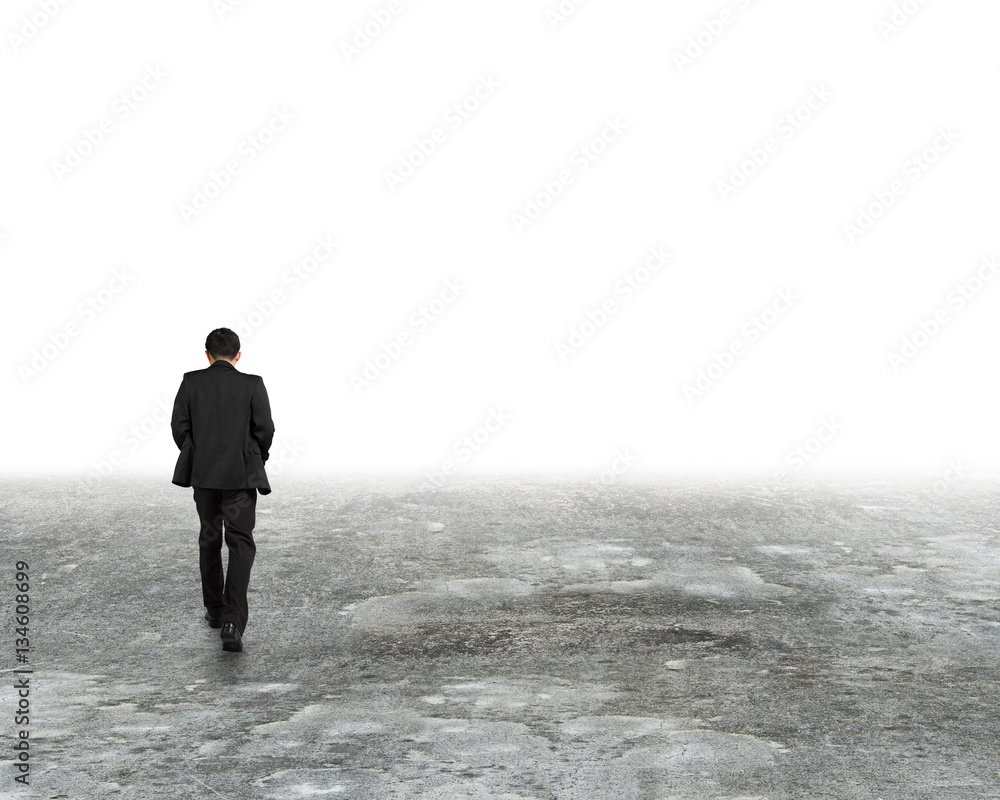 Man walking in mist on dirty concrete floor Man walking in mist on dirty concrete floor