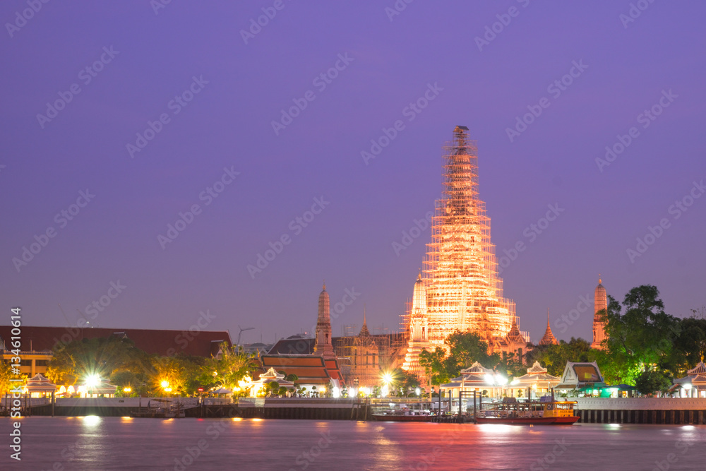 Wat arun with vivid twilight sunset sky with long exposure effec