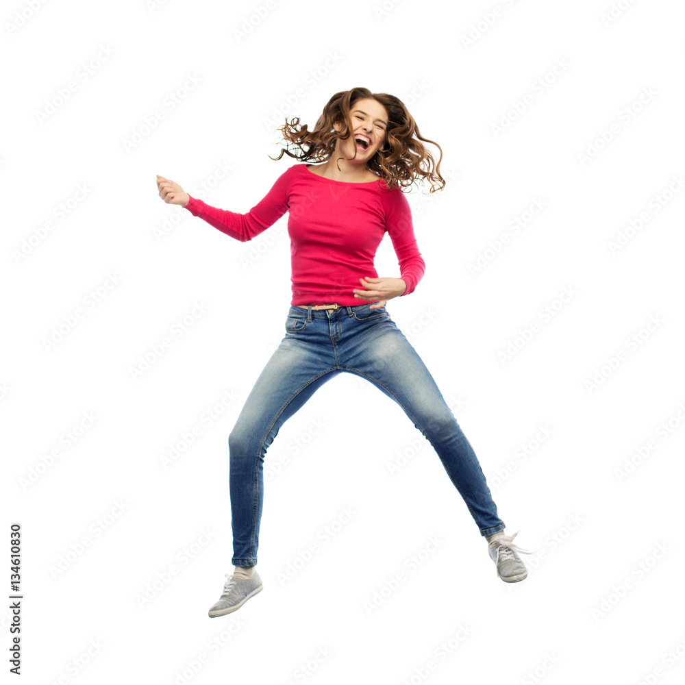 happy woman jumping and pretending guitar playing happy woman jumping and pretending guitar playing