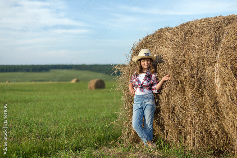 Cute Child having fun outdoors little girl cowboy playing in