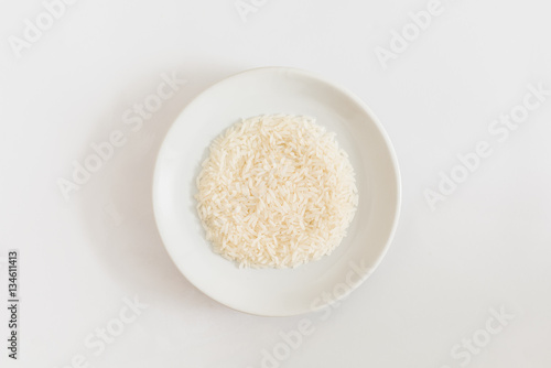 rice in white plate on white background