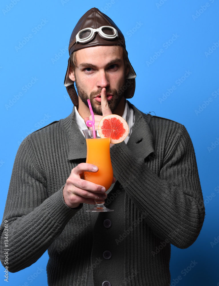 Fototapeta premium bearded pilot with cocktail in glass