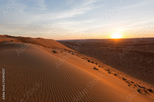 Sunset in the sand desert of Oman
