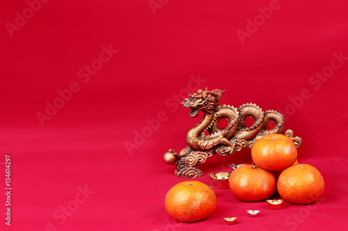 Golden orange with golden dragon and silver celebrate the blessi photo