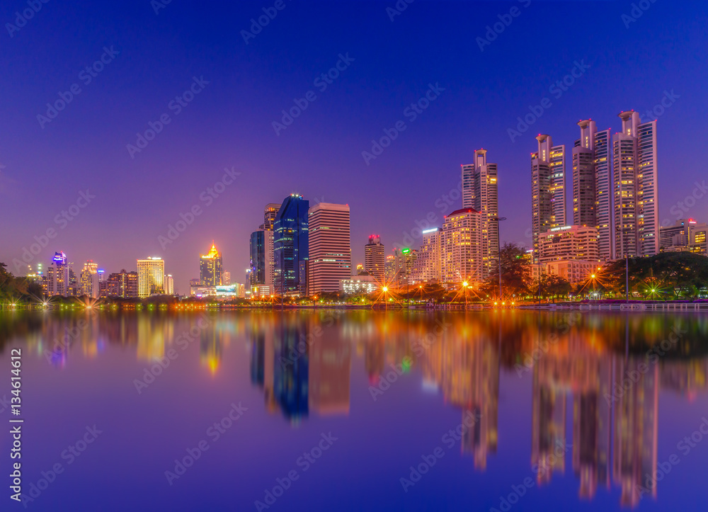 Cityscape image of Benchakitti Park at twilight time in Bangkok, Thailand.