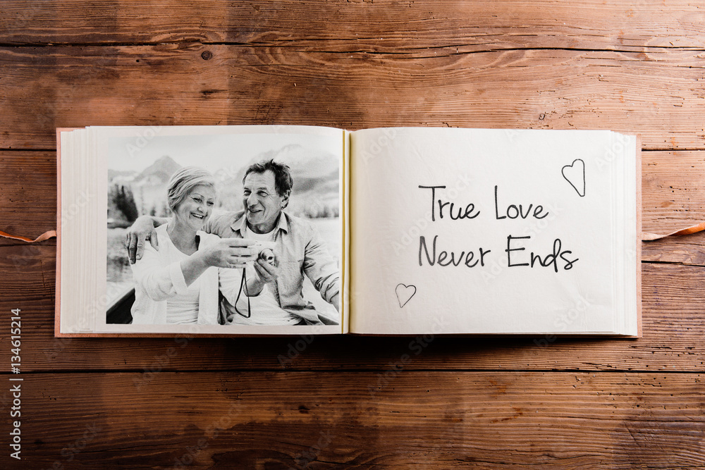 Photo album with black-and-white picture of senior couple. Photos