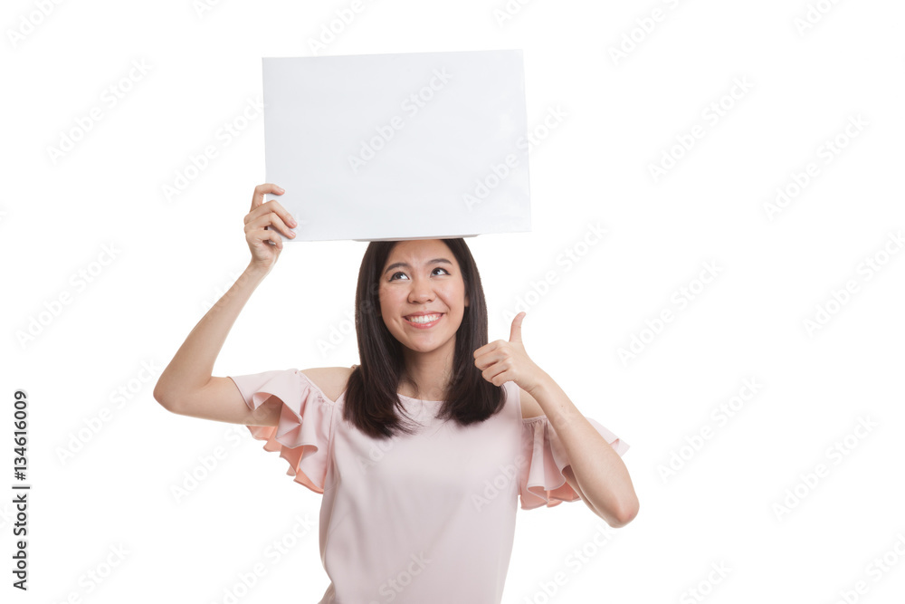 Young Asian business woman show thumbs up with white blank sign Young Asian business woman show thumbs up with white blank sign