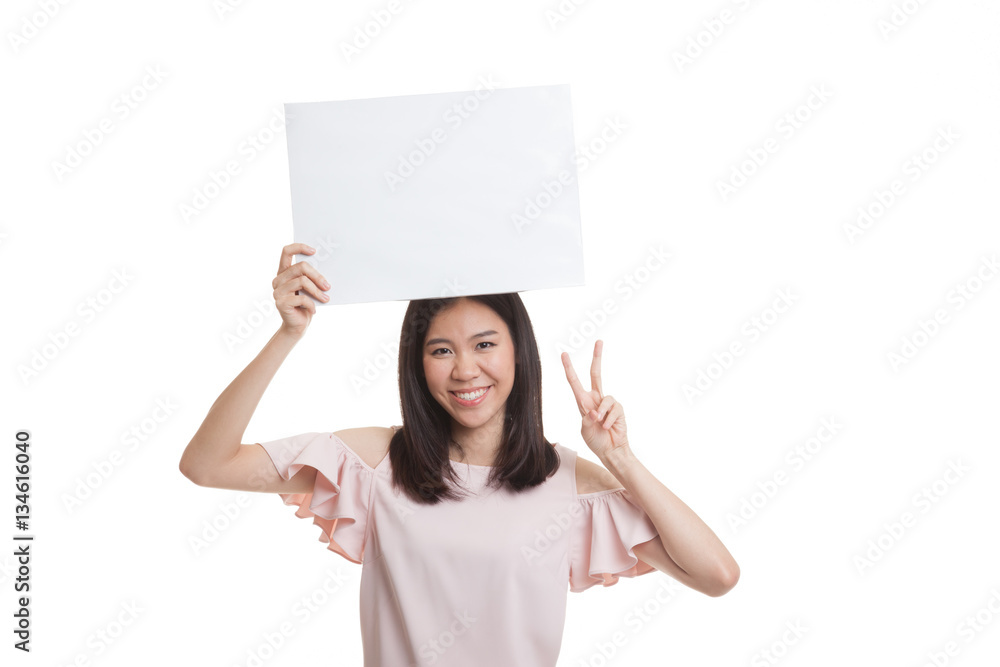 Young Asian business woman show victory sign with blank sign. Young Asian business woman show victory sign with blank sign.