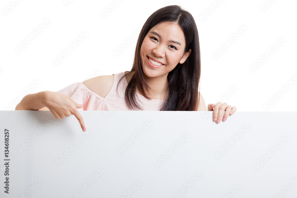 Young Asian woman point to a blank sign. Young Asian woman point to a blank sign.