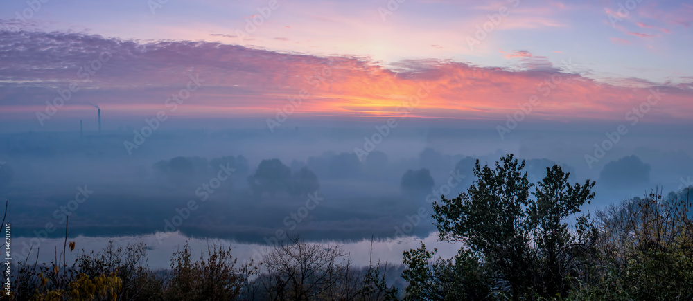 panorama of sunrise over the river and fog