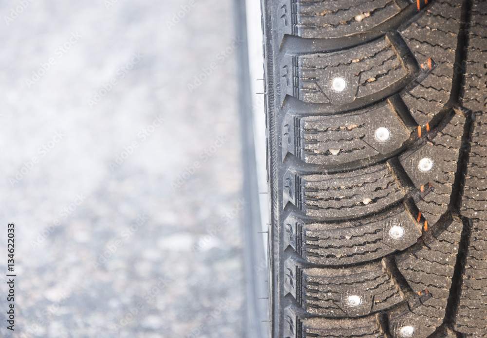Close up of a cars tires on a snowy road Close up of a cars tires on a snowy road