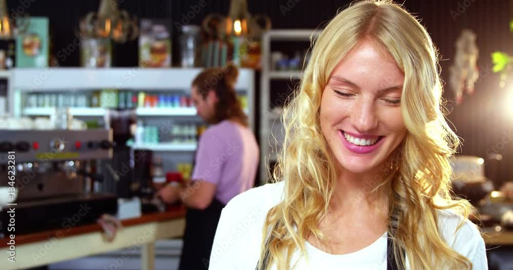 Portrait of waitress using digital tablet at counter in café 4k Portrait of waitress using digital tablet at counter in café 4k