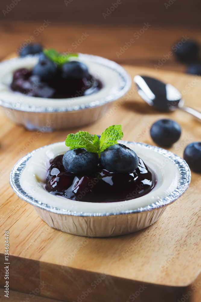 blueberry cheesecake for refreshment on wooden board blueberry cheesecake for refreshment on wooden board