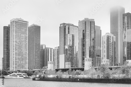 Black and white photo of Chicago modern waterfront in a foggy day, USA.