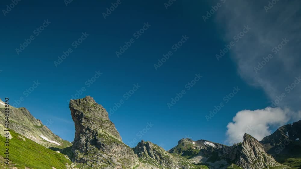 timelapse of the Great St Bernard Pass and surrounding mountains in the Alps where Italy and Switzerland meet. this high road pass at 2469m is only open in the summer months. timelapse of the Great St Bernard Pass and surrounding mountains in the Alps where Italy and Switzerland meet. this high road pass at 2469m is only open in the summer months.