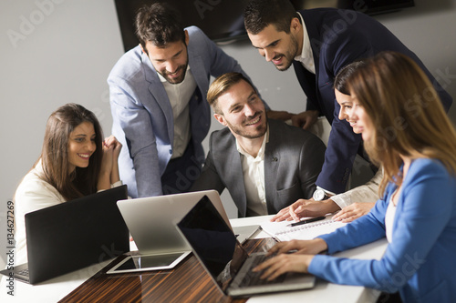 Young successful managers discussing new business project